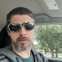 a man wearing sunglasses in a car